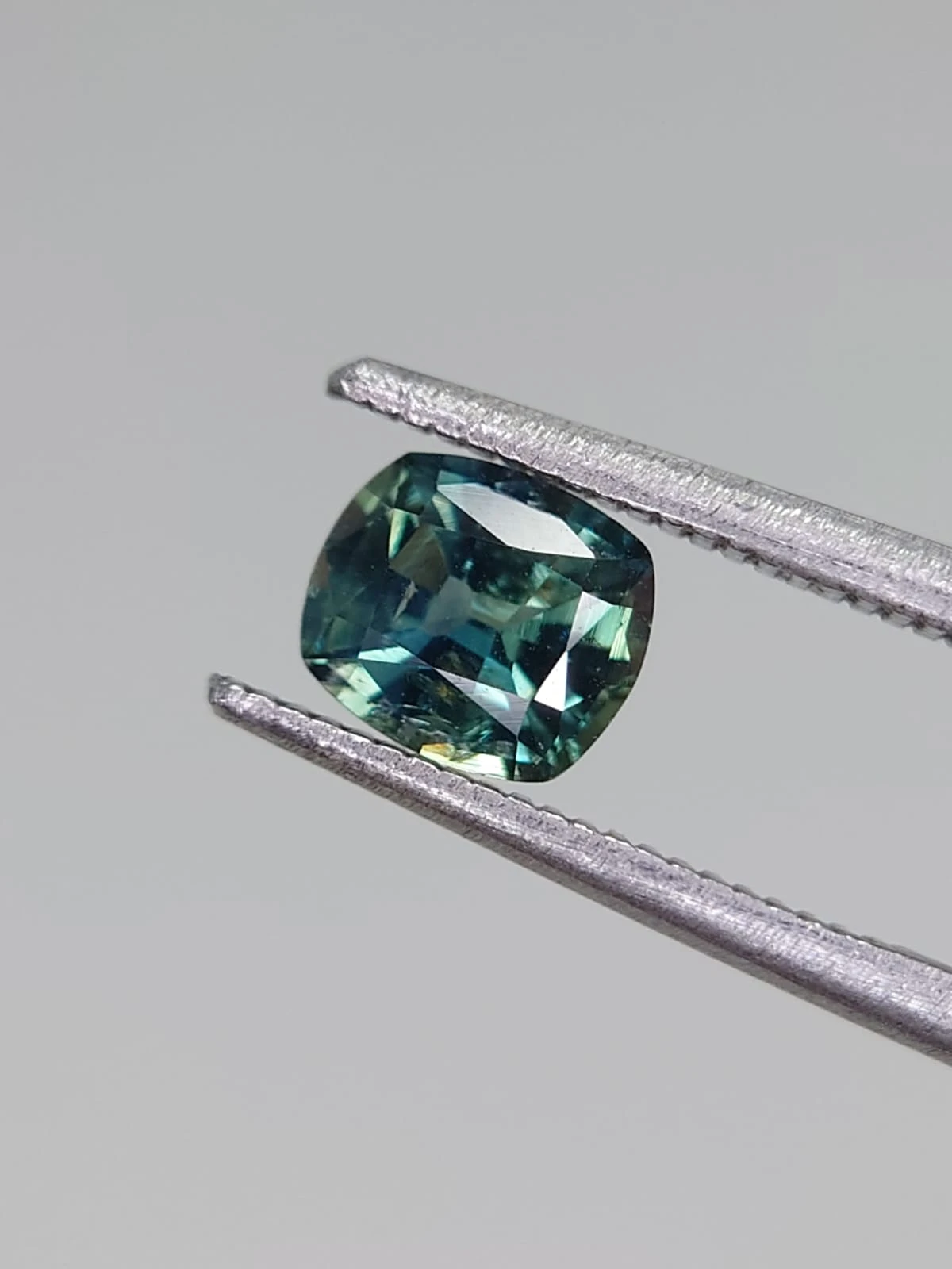 0.8ct Natural Teal Green Sapphire in Fancy Cushion Cut from Nigeria — view 1